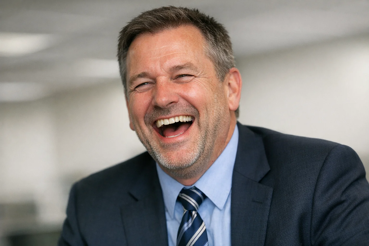 Laughing man in a suit